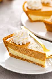 This Phenomenal Pumpkin Pie Cheesecake Has A Thick Layer Of Cheesecake Topped With A L Pumpkin Pie Cheesecake Easy Easy Pumpkin Pie Pumpkin Cheesecake Recipes