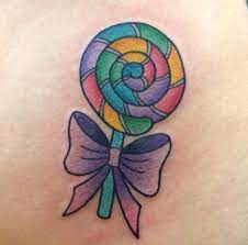 The color is so sweet you'll want to lick your clients tattoos. Lollipop Tattoos Inked Magazine Candy Tattoo Kawaii Tattoo Cupcake Tattoos