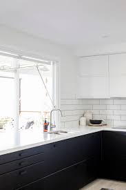 If you love wearing black and have been waiting to incorporate the rich hue into your kitchen décor, now is the time to shamelessly coat your cabinets in darkness. Parakeet Kitchen Featuring A 40mm Stone Bench Top Matte Black Bottom Cabinetry Interior Design Kitchen Contemporary Kitchen Interior Black Kitchen Handles