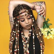 At the same time, the front positioned short braids and the coffee colored beads have brought an extent level of beauty for her. Braids With Beads Hairstyles For A Beautiful And Authentic Look