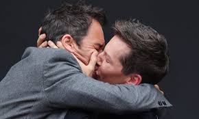 Sean Hayes and Eric McCormack smooch at photo-call