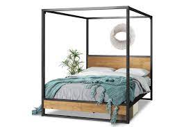 Metal canopy beds are usually not ornamented but you can sometimes find a couple of decorations somewhere. Dick Smith Zinus Suzanne Ironline Canopy Metal And Wood Bed Frame Double Queen Size Home Garden Furniture Beds Mattresses Beds Bed Frames