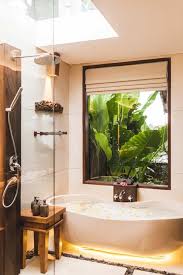 50 Tropical Style Primary Bathroom Ideas Photos In 2020 Indoor Outdoor Bathroom Bathroom Photos Bathroom Styling