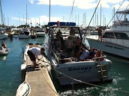 Father & son jump overboard as flames devour sailboat