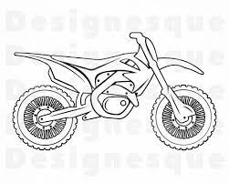 A dirt bike standing on a sand dune, the sea (ocean) in the background. Pin On Products