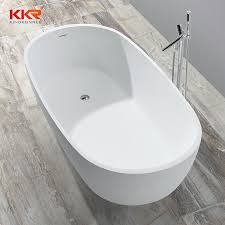 A cool freestanding tub in a niche, half curtains for privacy and shelves on each side of the bathtub. China Ce Acrylic Solid Surface Stone Soaking Bathtub Shower Freestanding Tub China Bath Tub Bathtub For Dubai