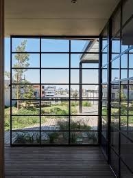 Steel Framed Glazing Lining The Apartments On The Southern Side Of The Building Evokes The Crittall Windows Of T Winter Garden Architecture Garden Architecture