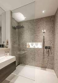 This bathroom uses wood tile bathroom ideas to divide the room into three sections. 44 Modern Shower Tile Ideas And Designs 2021 Edition
