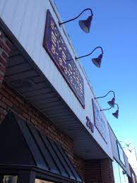 Photo Showing Our Gooseneck Sign Lights Mounted Outside South Nassau Eye Care Light Fixture 20 853 In Black South Nassau Sign Lighting Retail Signage Lights