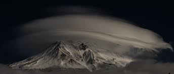 Lenticular clouds swirl over Mt. Shasta