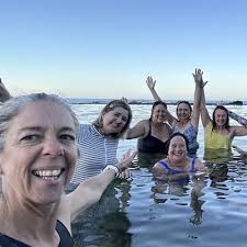 Women braving cold sea waters for solstice plunge