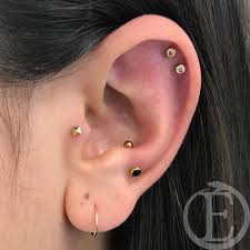 Come On By Our Long Beach Location And Get Your Ear Curated By Dee Downsizes For Sarah S Beautifully Decorated Ears Swipe Earings Piercings Piercings Earrings