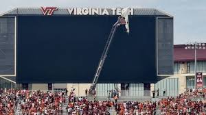 Skydiver gets rescued after crashing into scoreboard before Virginia Tech  spring game | WBEN