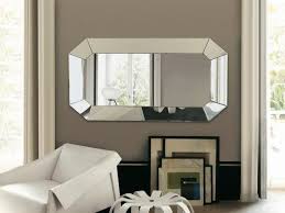 Somewhat disguised by the hypnotizing pattern surrounding it, the mirror in the room above creates the illusion of there being another room beyond the sink. Living Room Decorating Ideas With Mirrors Ultimate Home Ideas