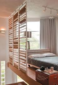 The layers of knit and quilted bedding, the gorgeous carved frames on the mirrors, the area rug layered over tile, the silky fabric on the pouf. 29 Impressive And Chic Loft Bedroom Design Ideas Digsdigs