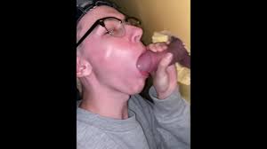 Horny twink decided to suck dick in gloryhole while daddy gets pleasure and  cums on his face