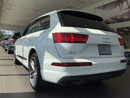 Rear Angled View Of The 2018 Audi Q7 In Carrara White Vehicle Available At Audi Of Bridgewater Nj Audi Dealership Audi Audi Q7