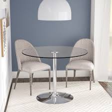 This table can accommodate up to four people comfortably, with standard dining height chairs. Small Round Glass Table Wayfair