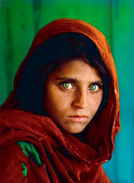 Sharbat Gula, Afghan Girl, at Nasir Bagh refugee camp, Peshawar, Pakistan,  1984. Afghan Girl is a 1984 photographic portrait of Sharbat Gula, also  known as Sharbat Bibi, by journalist Steve McCurry. It