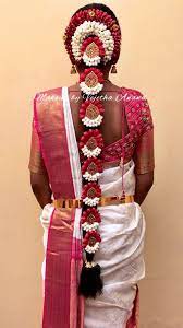 South Indian Bride S Bridal Hairstyle Braids With Fresh Flowers Bridal Hair Hai South Indian Bride Hairstyle Indian Bride Hairstyle Indian Bridal Hairstyles