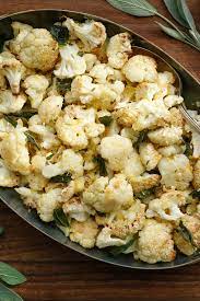 Roasted Cauliflower With Feta Almonds And Olives Recipe Nyt Cooking Roasted Cauliflower Thanksgiving Recipes Side Dishes Recipes