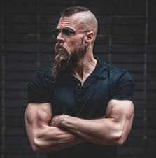 Ragnar top undercut with tattoo. 30 Kickass Viking Hairstyles For Rugged Men Hairmanz