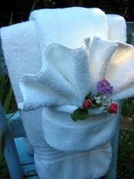 Looking for inspiration to solve a storage issue and enhance your bathroom design? The Red Chair Blog Fancy Shmancy Towel Fold Tutorial How To Fold Towels Fancy Towels Towel Origami