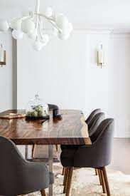 It is handcrafted out of solid walnut and stained in a deep charcoal black finish, hand polished to a luxurious sheen. Modern Wood Slab Dining Room Table Paired With Charcoal Fabric Dining Chairs S Slab Dining Room Table Dining Room Chairs Modern Mid Century Modern Dining Room