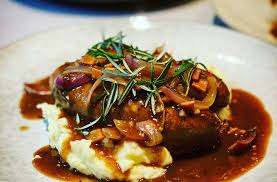 Click play to see this traditional bangers and mash with onion gravy recipe come together for a meat and potatoes dinner, this is an excellent recipe. Beef Sausages With Beer Bacon Onion Gravy Em S Food For Friends