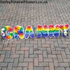 Paying your respects with a traditional funeral tribute, basket or urn tribute is a wonderful option in plymouth. Granny Rainbow Coloured Named Letter Funeral Flowers Derby