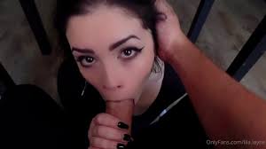 Goth babe Lila Layne gives amazing head under the table - Blowjobit