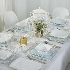 The table includes a center leaf to accommodate extra guests. Dining Sets Ebarza