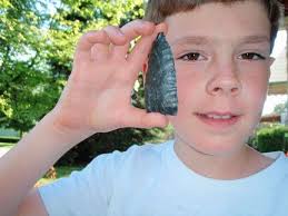 Some teens exploring ancient American ruins and discovering a curious  artifact