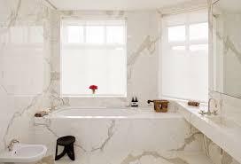 This beautiful marble is sure to change any room from ordinary to noteworthy. This Gorgeous Bathroom Has Calacatta Oro Marble Walls And Floor White Marble Bathrooms Master Bathroom Design Marble Bathroom Designs