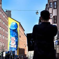 Five-storey blue penis mural erected on a building in Stockholm | Mashable