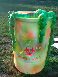 Biohazard Halloween Prop Made From Plastic Barrel Spray Paint And Stencils Bought And Made On Cricut Alien Halloween Alien Party Halloween Hacks