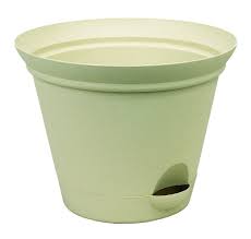 This bold planter has a modern style with smooth walls, a rounded top edge, and logo stamp details at the bottom and top. How Do Self Watering Planters Work Organic Gardening Tips