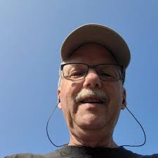 How many times has Dean Smith missed the tournament and how many times has  Roy Williams missed the tournament at Carolina?