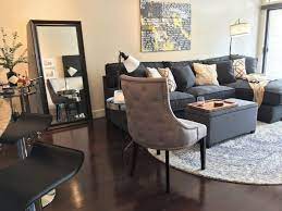 This video gaming room idea utilizes the existing design of the living room, but with a little adjustment. Decked Out Apartment Living Room For A Swank Young Couple 4th House On The Right Apartment Living Apartment Living Room Living Room