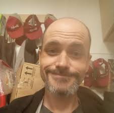 What is Baloo wearing when he sings 'I Wan'na Be Like You' in The Jungle  Book?