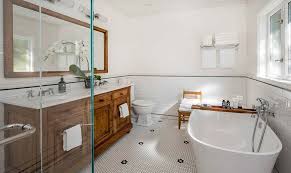 Nice bathroom with natural stone tiles and wood cabinet. 25 Wood And White Bathrooms For A Trendy Relaxing Shower