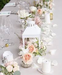 20 Lantern Wedding Centerpiece Ideas On Budget In 2020 Lantern Centerpiece Wedding Wedding Floral Centerpieces White Flower Centerpieces