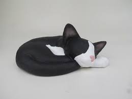 Looking for a wonderful memorial urn for your beloved cat? Sleeping Black And White Tuxedo Cat Shaped Cremation Urn For Ashes