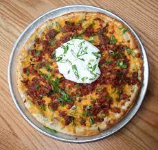 Pizza Skins At Www Piesandpints Net Roasted Garlic Mashed Potatoes Cheddar Cheese Bacon And Scallions Baked On Our Pizz Recipes Appetizer Snacks Yummy Food