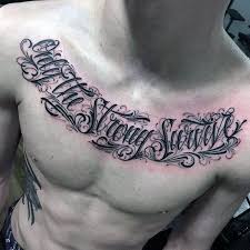 Top 41 Chest Writing Tattoo Ideas 2020 Inspiration Guide Tattoo Fonts Tattoo Quotes Writing Tattoos