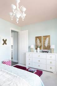 A Pink Ceiling Beautifully Complements Light Blue Walls In This Stylish Girl S Bedroom Decorated With White Blue And Gold Bedroom Light Blue Rooms Gold Bedroom