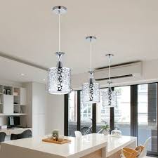 In a dining room, a beautiful chandelier will create a sense of class and formality, even if the furniture in the space isn't exactly formal. Dining Room Ceiling Lights Wild Country Fine Arts