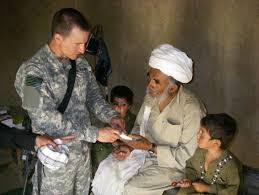 Maj Dr Andrew Morgan Provides Medical Assistance To Afghan Civilians During His 2009 Deployment Maj Morgan Was Cho Medical Surgeon Doctor Nasa Astronauts