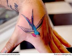 Swallow Bird Tattoo On Hand Meaning Meaning And Pictures Of Swallow Tattoo Designs Hand Tattoos Swallow Tattoo Swallow Tattoo Design