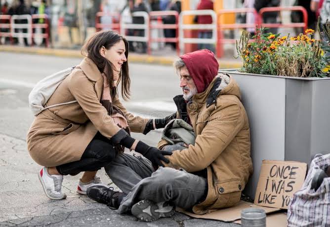 Image result for giving food clothing to poor beggar needy people"
